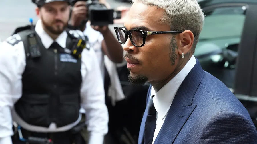 Singer Chris Brown pleads guilty to affray over London club bottle attack
