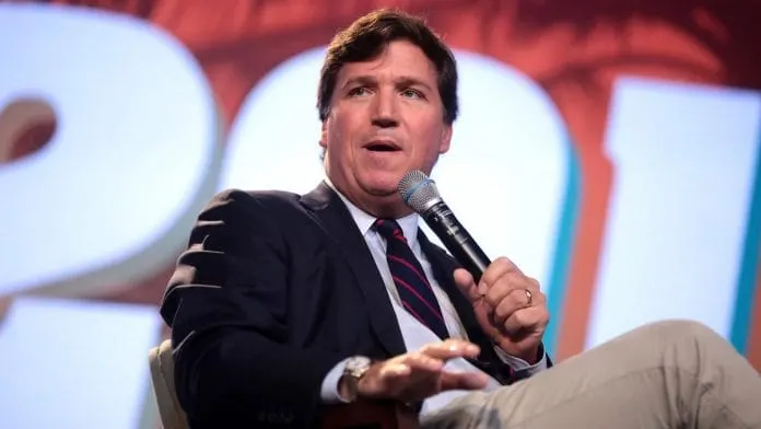 Tucker Carlson defends Democrat in Senate race