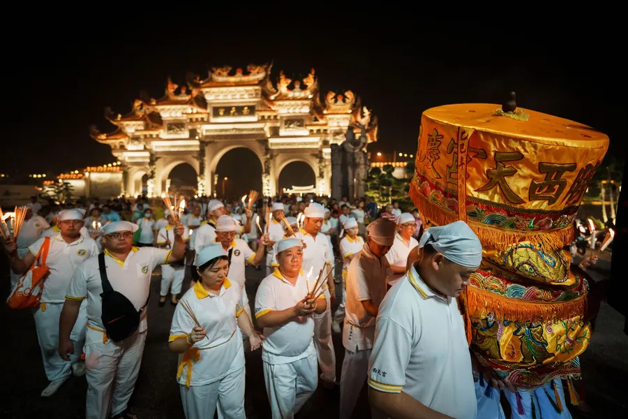 AP photos show fire walking and incense burning at Malaysia's Nine Emperor Gods Festival